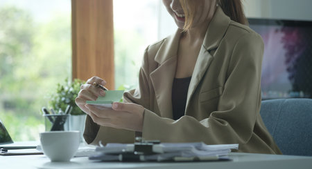 Cropped shot professional businesswoman working at modern workplace.の写真素材