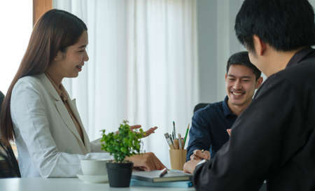 Businesspeople working on their project together in office room.
