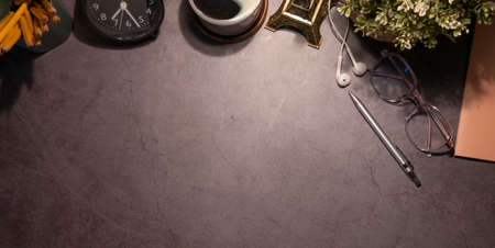 Above view simple workplace with books, coffee cup and pencils on wooden table.の写真素材