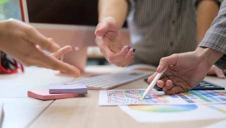 Group of young creative coworkers working with new startup project together in office.の写真素材