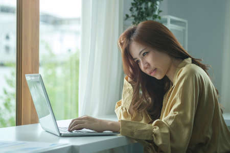 Stressed businesswoman having problems with project.