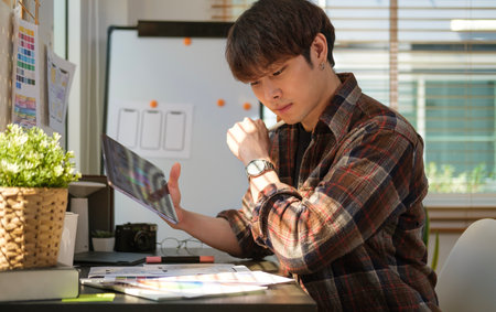 Creative ux designer sketching and designing smartphone application layout prototype at modern office.の写真素材