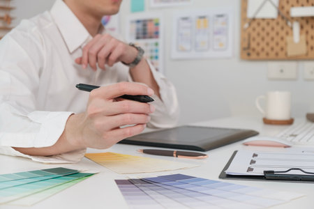 Cropped shot of ux designer working on a new app design and planning application development for mobile phone at workstationの写真素材