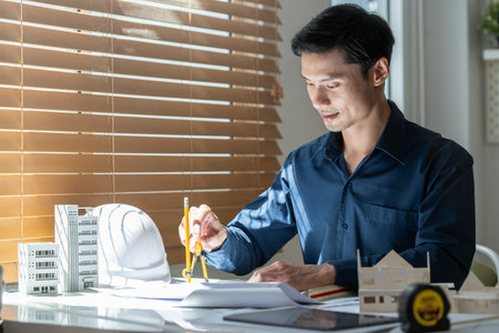 Architect working on project in office for architectural plan.の写真素材