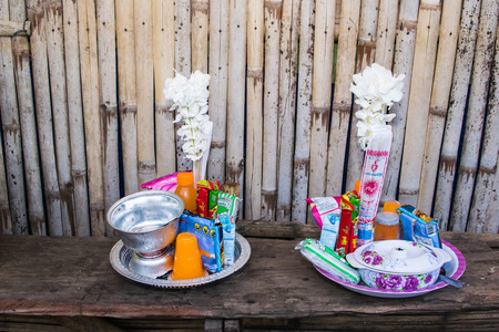 KANJANABURI THAILAND JULY 19 : Flower and food in tray on table offer to monk in Buddhist Lent Day at Mon people village on July 19 2016,Kanjanaburi Thailand.のeditorial素材