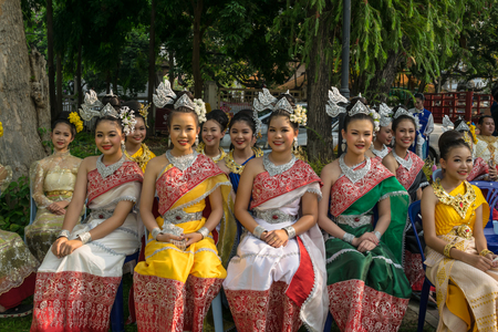 CHIANGMAI THAILAND - APRIL 13 :Unidentified Northern young lady dressed in Lanna costume sitting on the chair in Songkran festival on April 13,2017 Chiangmai Thailand.のeditorial素材