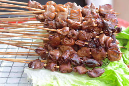 Grilled pork offal with wood stick,Street food  in Thailand.の写真素材