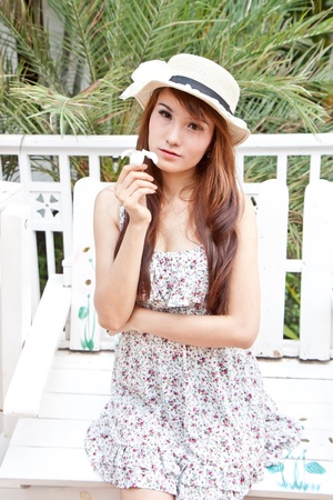 Beautiful asian woman and flower in modern vintage conceptの写真素材