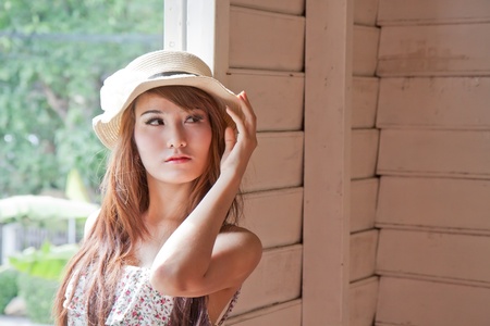 Beautiful asian woman looking from the window in modern vintage conceptの写真素材