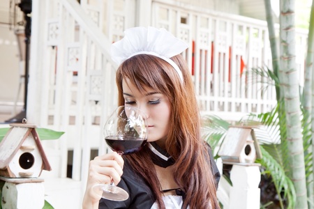 Asian woman with wine glass conceptの写真素材
