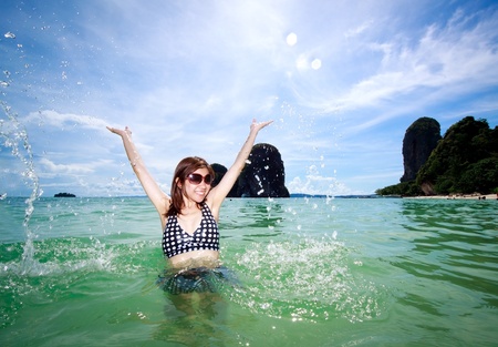 Asian woman relaxing on the sea, oceanの写真素材