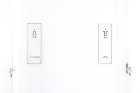 Toilet signs on white wall, signs backgroundの写真素材