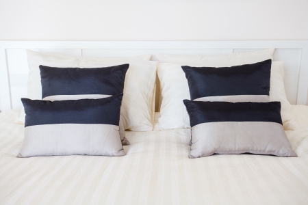 Luxury room setting with bed and pillowsの写真素材