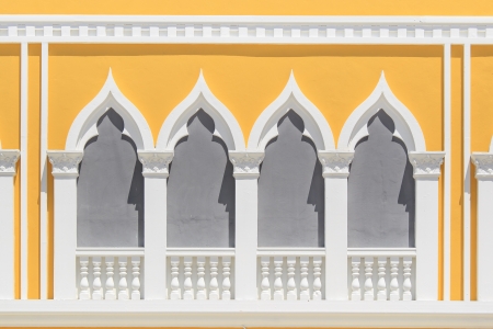 vintage windows on the yellow wallの写真素材