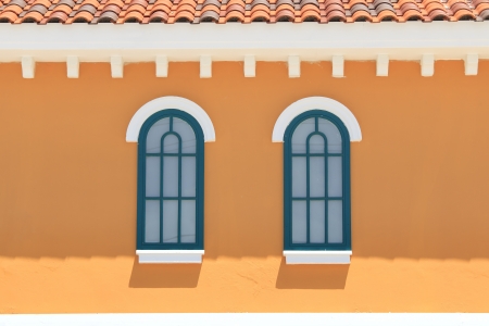 vintage windows on the yellow wallの写真素材