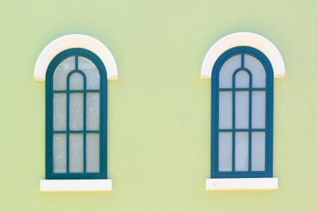 vintage windows on the green wallの写真素材