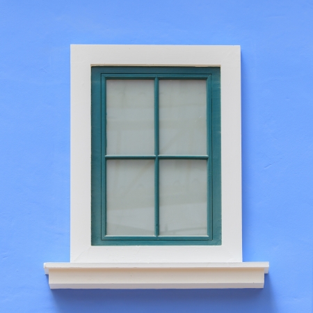 vintage windows on the blue wallの写真素材