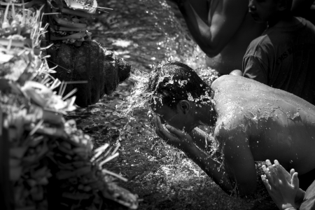 Hindu pilgrims take bath into holy waterの写真素材