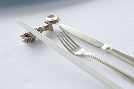 Table Chinese dinner setting with white linenの写真素材