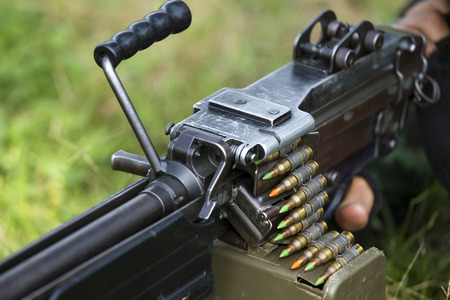 Soldier with the machine gun and ammunition