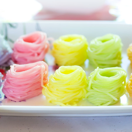 Colorful of asian noodles on white plateの写真素材