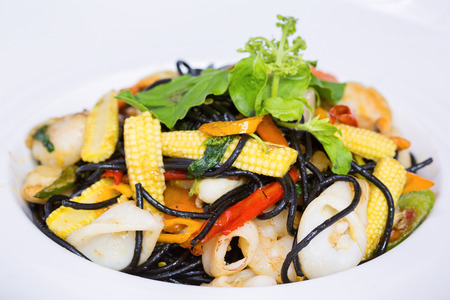 spaghetti with shrimp, mussel and squid (seafood) on white plateの写真素材