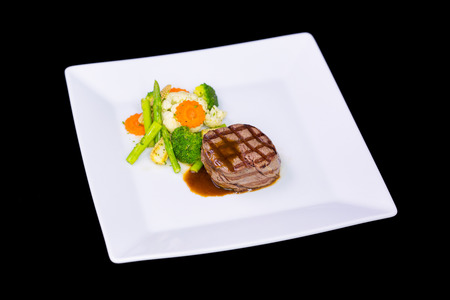 beef steak on white plateの写真素材