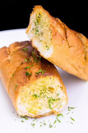 Fresh Garlic breads on white plateの写真素材