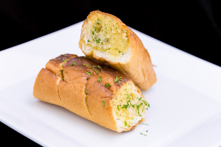 fresh Garlic breads on white plateの写真素材