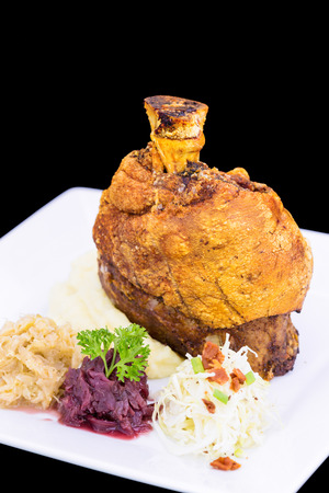 Roast Pork Knuckle on white plateの写真素材