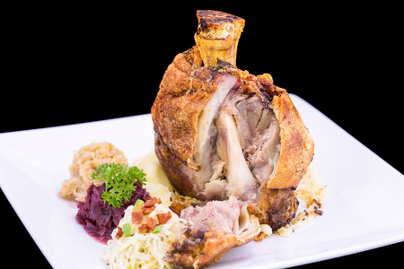 roast Pork Knuckle on white plateの写真素材