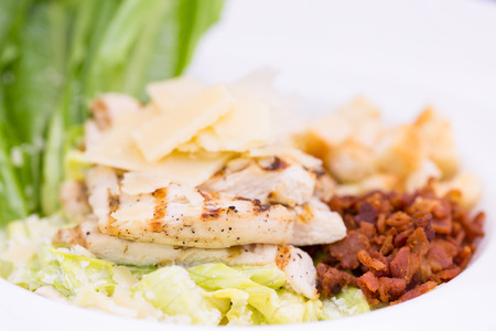 fresh salad with chicken on the plateの写真素材