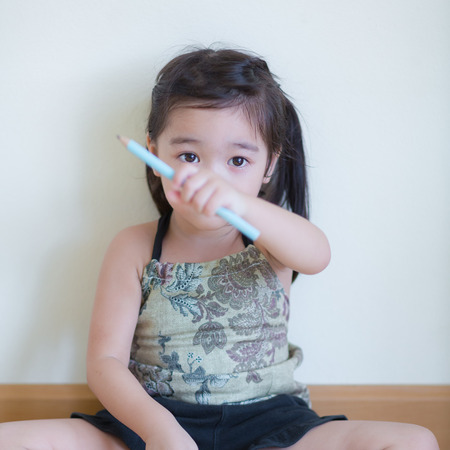 Kids in action of her houseの写真素材