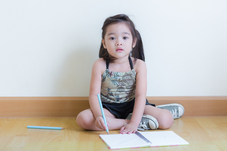 Kids in action of her houseの写真素材