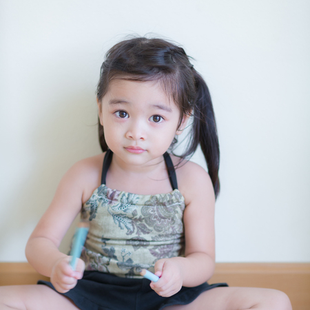 Kids in action of her houseの写真素材