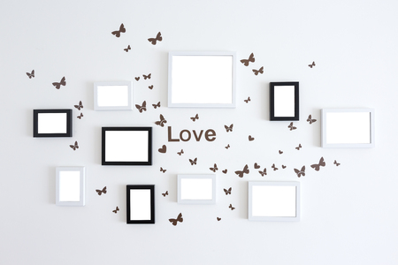 Love picture frames on white wall backgroundの写真素材