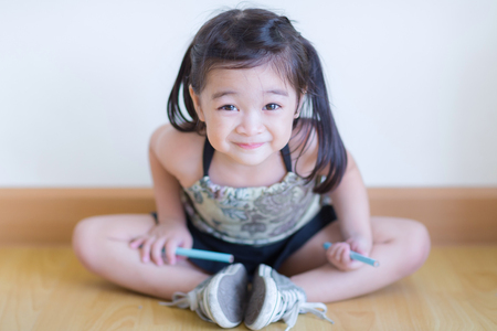 Kids in action of her houseの写真素材