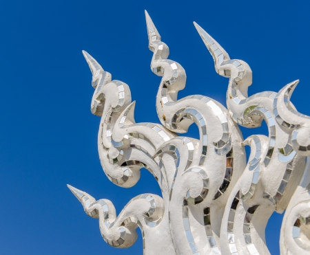 Architectural detail of Wat Rong Khun temple in Chiang Rai,  Thailand  の写真素材