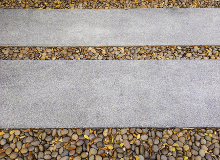Concrete pathway sprinkle Gravel ground walk to futureの写真素材
