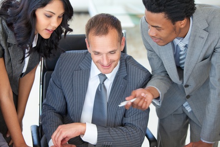 Manager with employees working in officeの写真素材