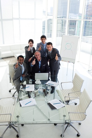 International business team with thumbs upの写真素材