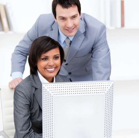 Two business partners working at a computer の写真素材