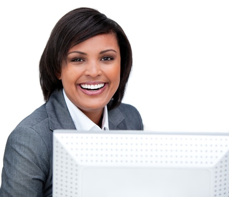 Positive businesswoman working at a computer の写真素材