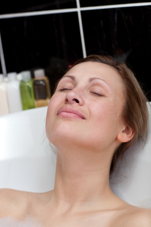 Relaxed woman having a bath 