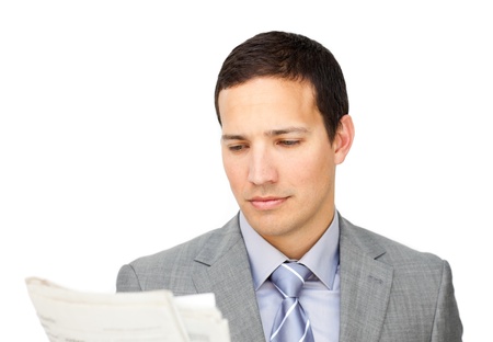 Concentrated businessman reading a newspaper の写真素材