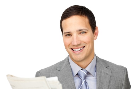Charismatic businessman reading a newspaper の写真素材