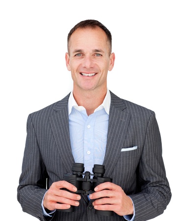 Happy businessman holding binoculars の写真素材