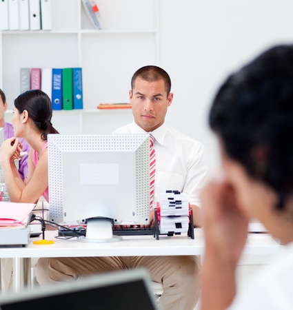 Serious businessman working at a computerの写真素材