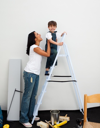 Happy little boy climbing a ladder の写真素材