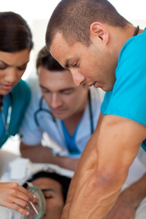 Doctors performing CPR on a patientの写真素材